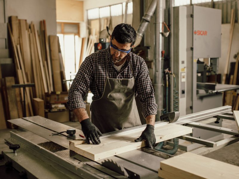 Skilled Carpenter craftsman at work in his workshop