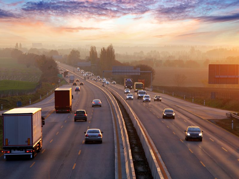 Traffic on highway with cars.