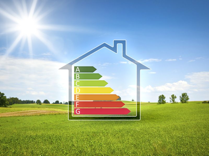 green house in the sun with energy efficiency graph