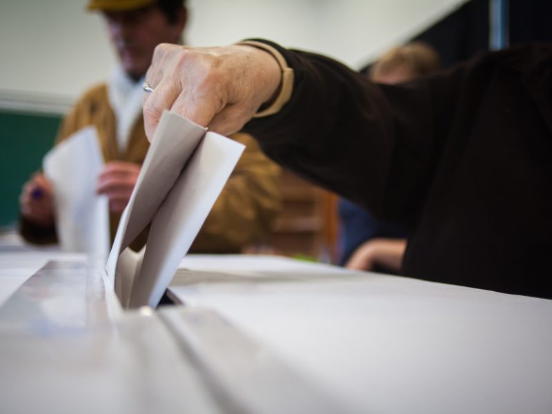 Person voting at polling station