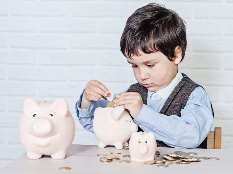 boy with pig piggy bank