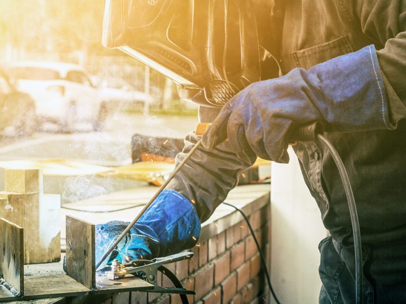 Man brewing a metal welding machine