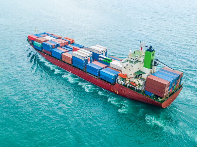 Aerial top view container cargo ship, Business logistic and transportation of International by ship in the open sea.