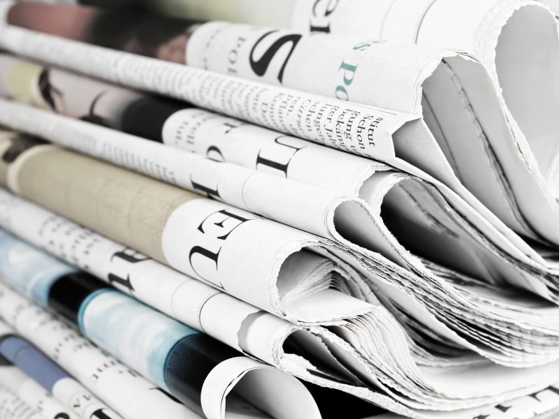 Pile of old newspapers, selective focus