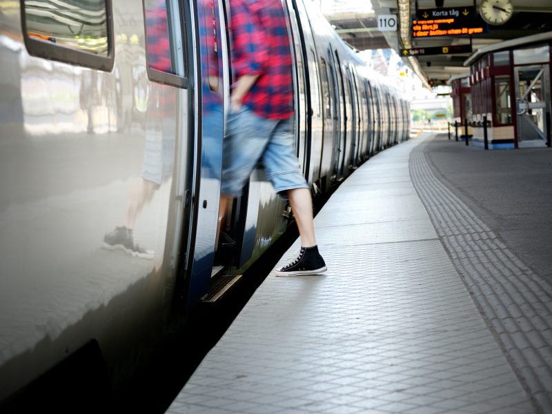 Motion blurred man entering train