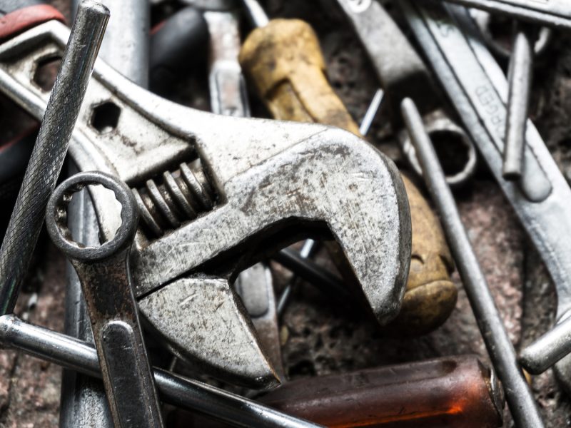 closeup view of work tools on brick ground