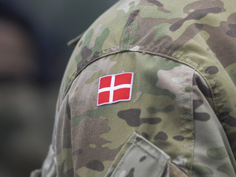 Danish army uniform with the Danish flag on the shoulder. Danish military, selective focus.