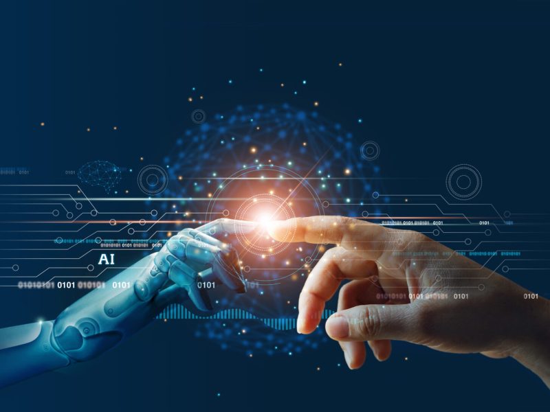 AI, Machine learning, Hands of robot and human touching on big data network connection background, Science and artificial intelligence technology, innovation and futuristic.