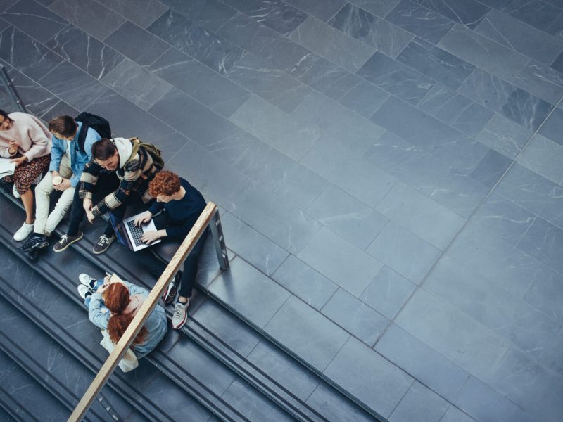 Young people studying in college campus