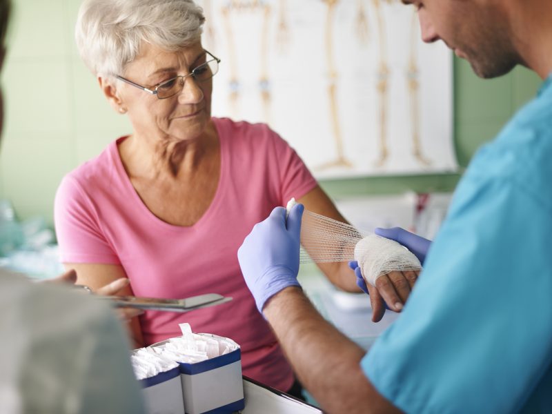 Senior woman with bandage on the hand