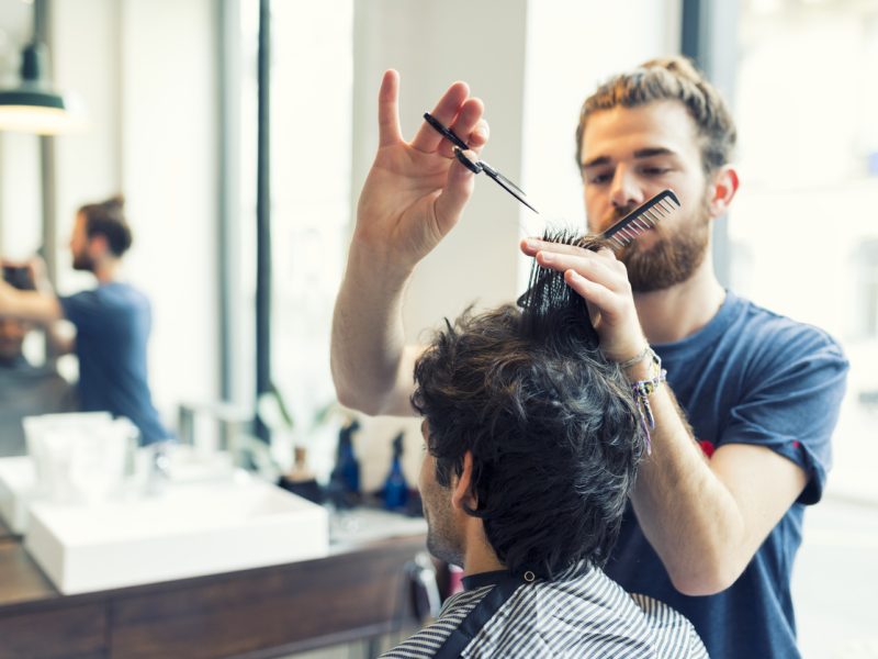 Man gets a haircut at his barber